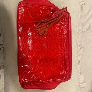Large red snakeskin clutch with tassel
